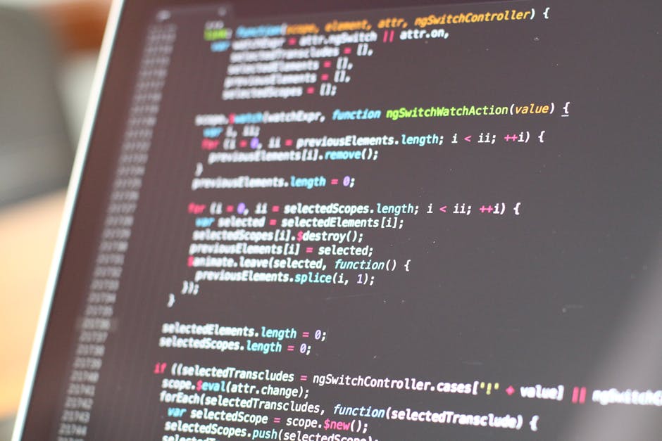 The image depicts a computer screen displaying lines of programming code with multicolored syntax highlighting, including various keywords, symbols, and text in shades of blue, pink, green, yellow, an